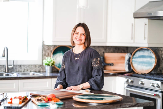 woman serving charcuteire in her kitchen