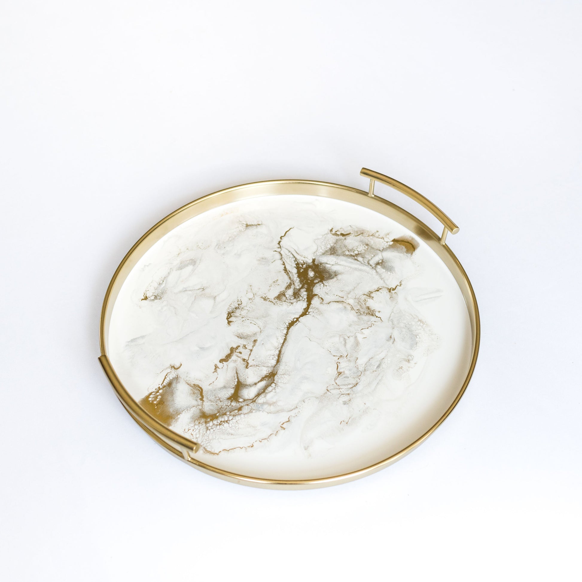 gold round metal tray accented with resin
