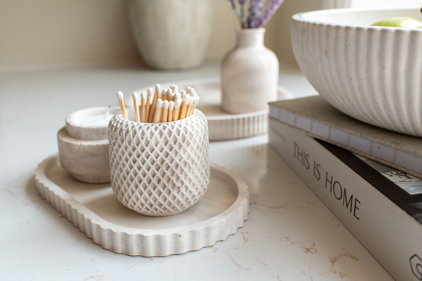 Limestone oval tray with the match and candle holder displayed as a set