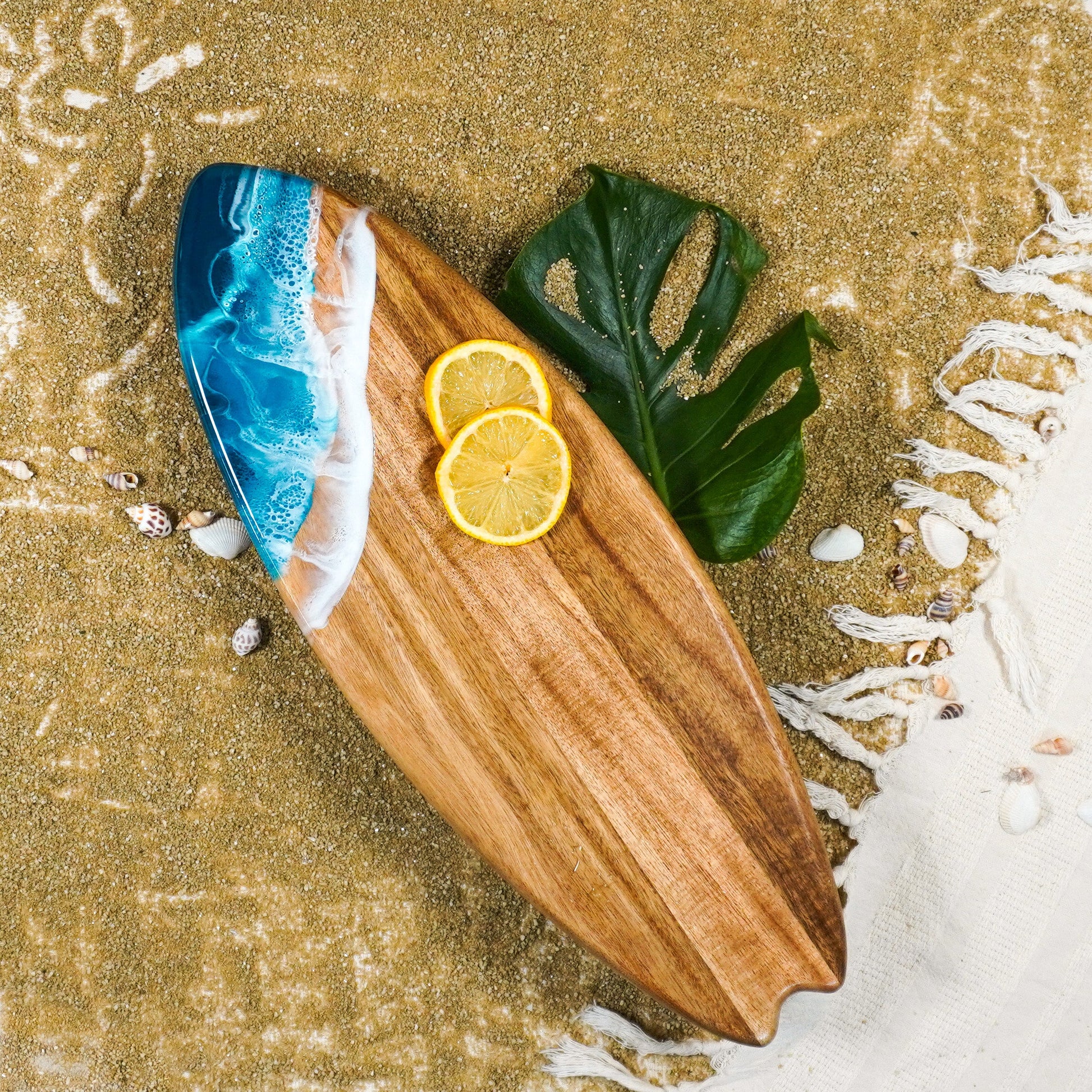 surfboard shaped charchuterie board accented with resin
