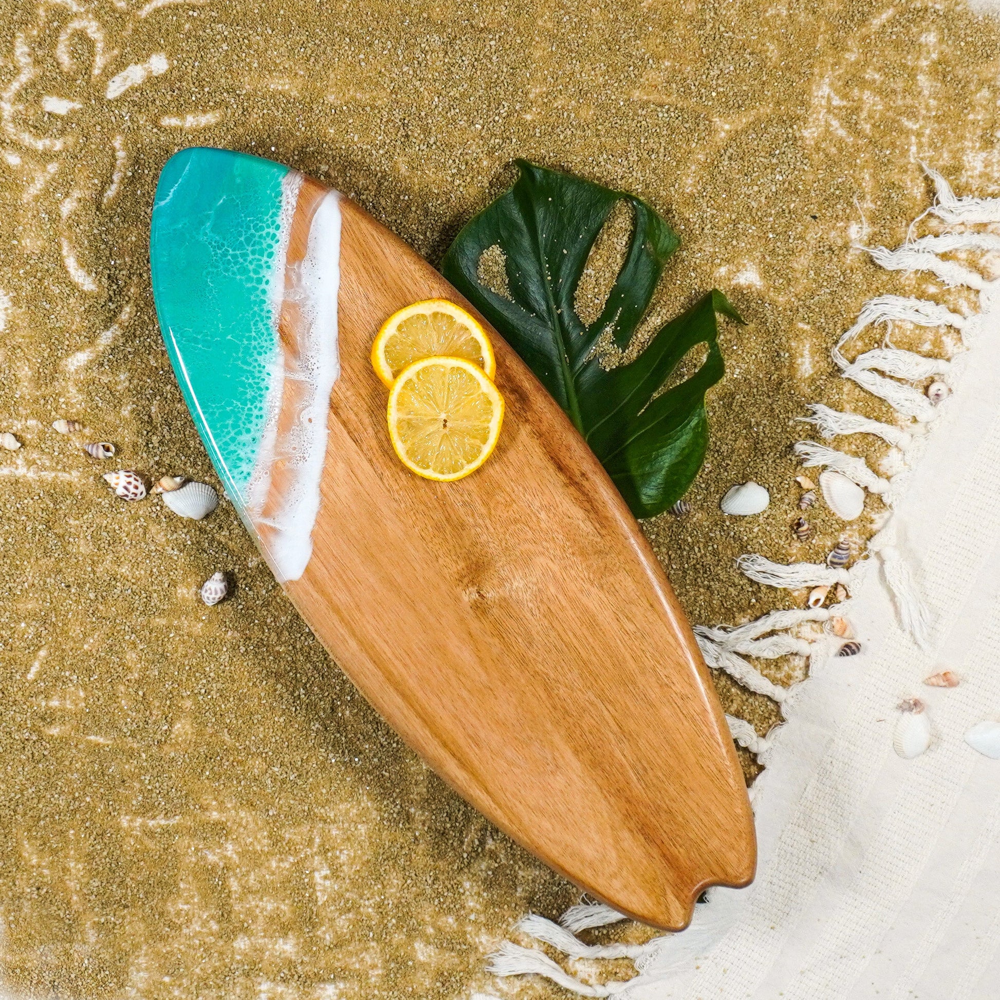surfboard shaped charchuterie board accented with resin