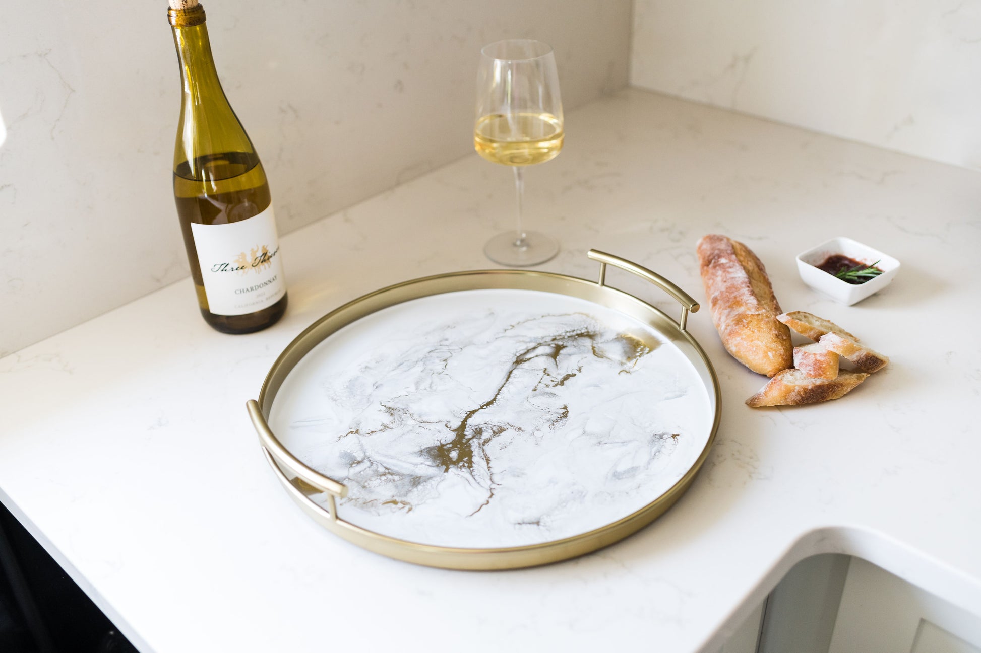 gold round metal tray accented with resin