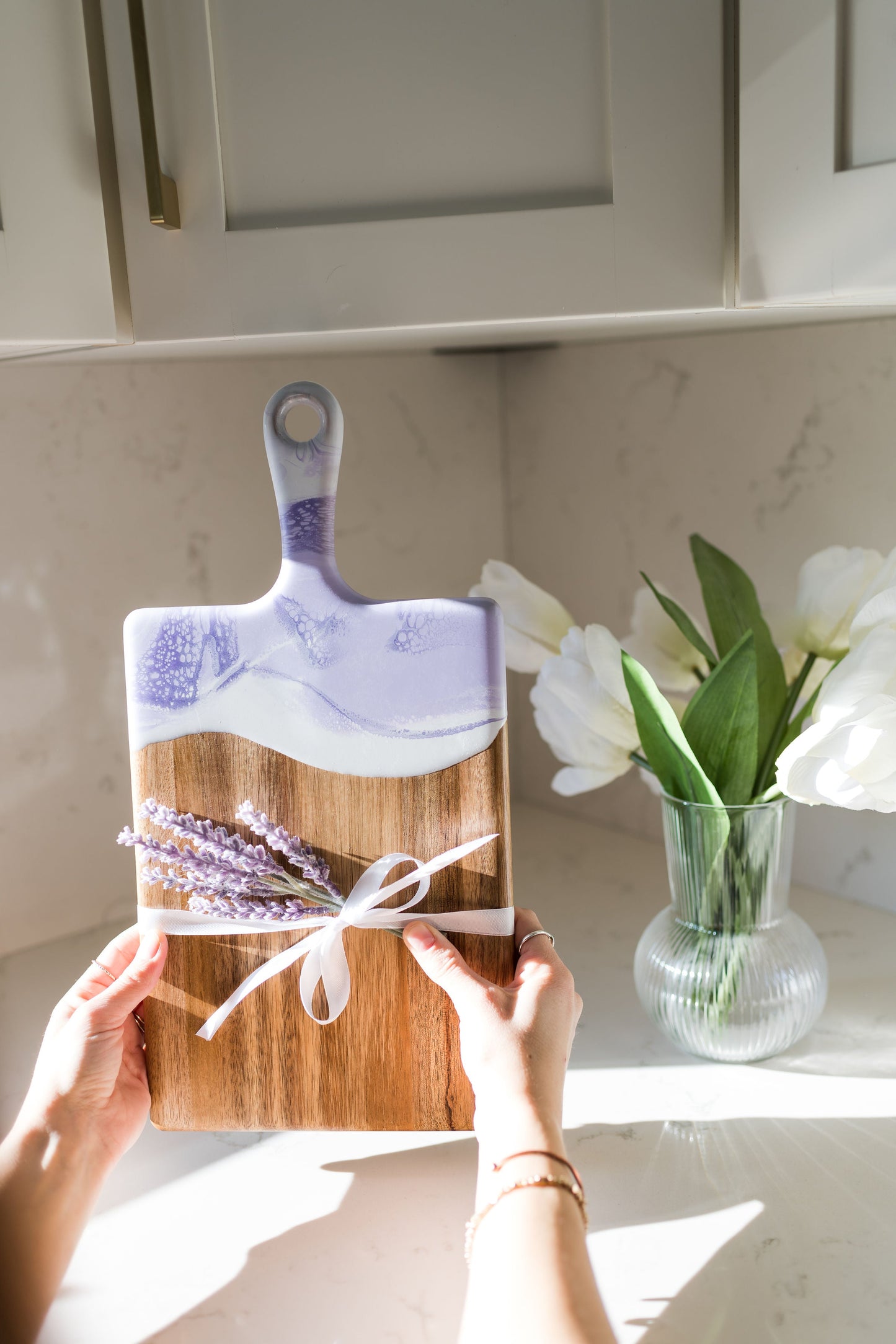 Medium Lavender board being held over the kitchen counter