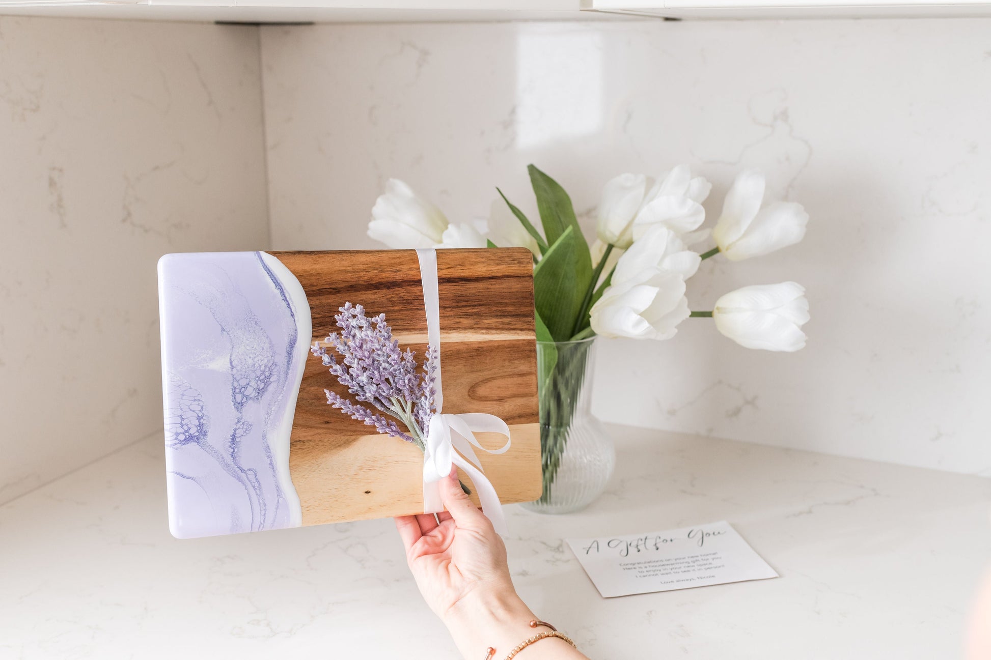 Lavender date night board being held over a kitchen counter