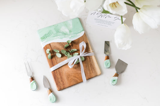 Mojito date night board with matching cheese knives on kitchen counter