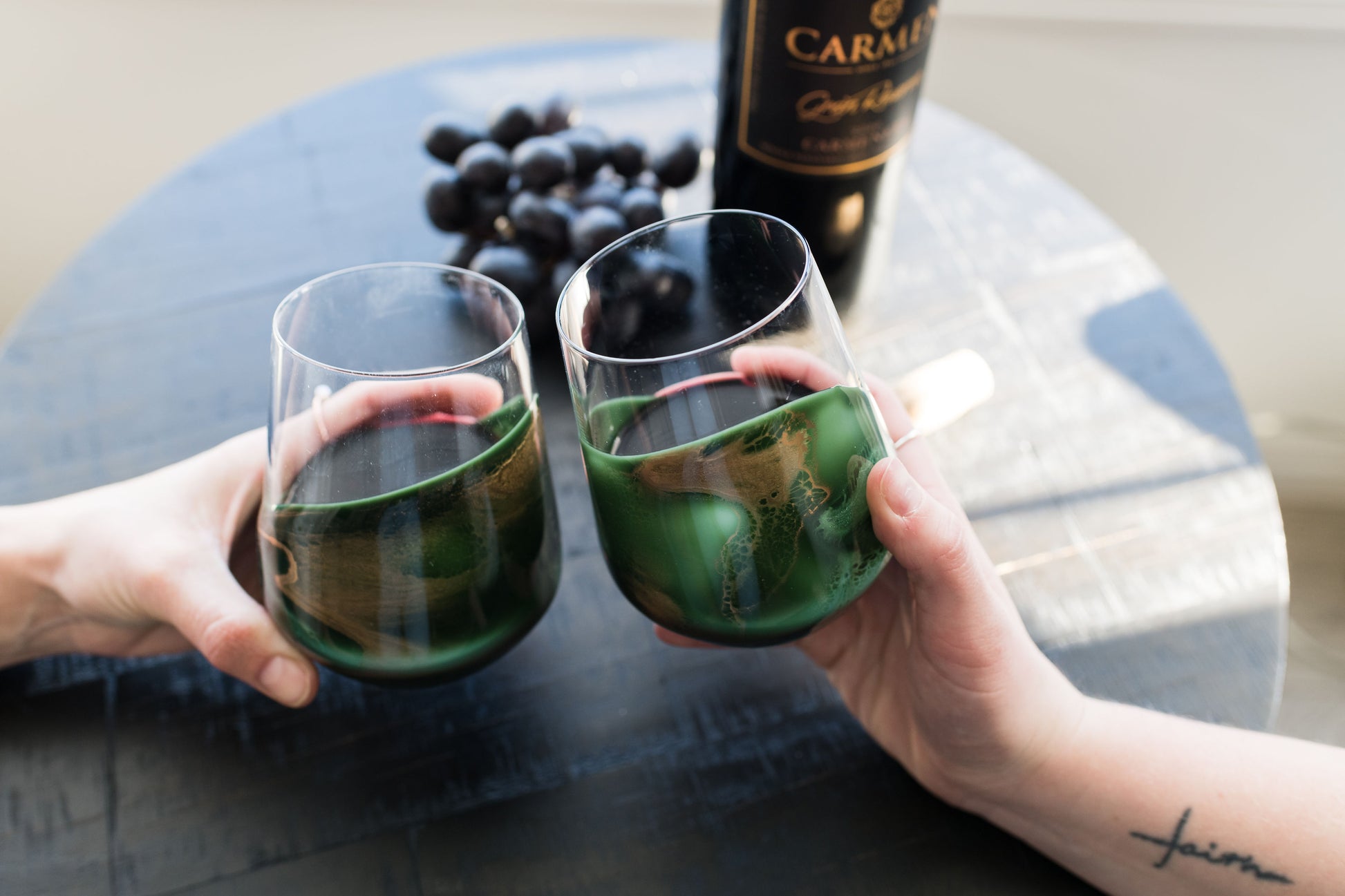 Jade Wine Glasses Held above coffee table