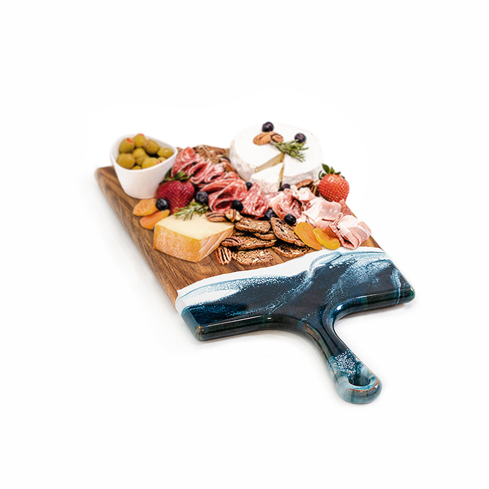 large acacia cheese board accented with resin