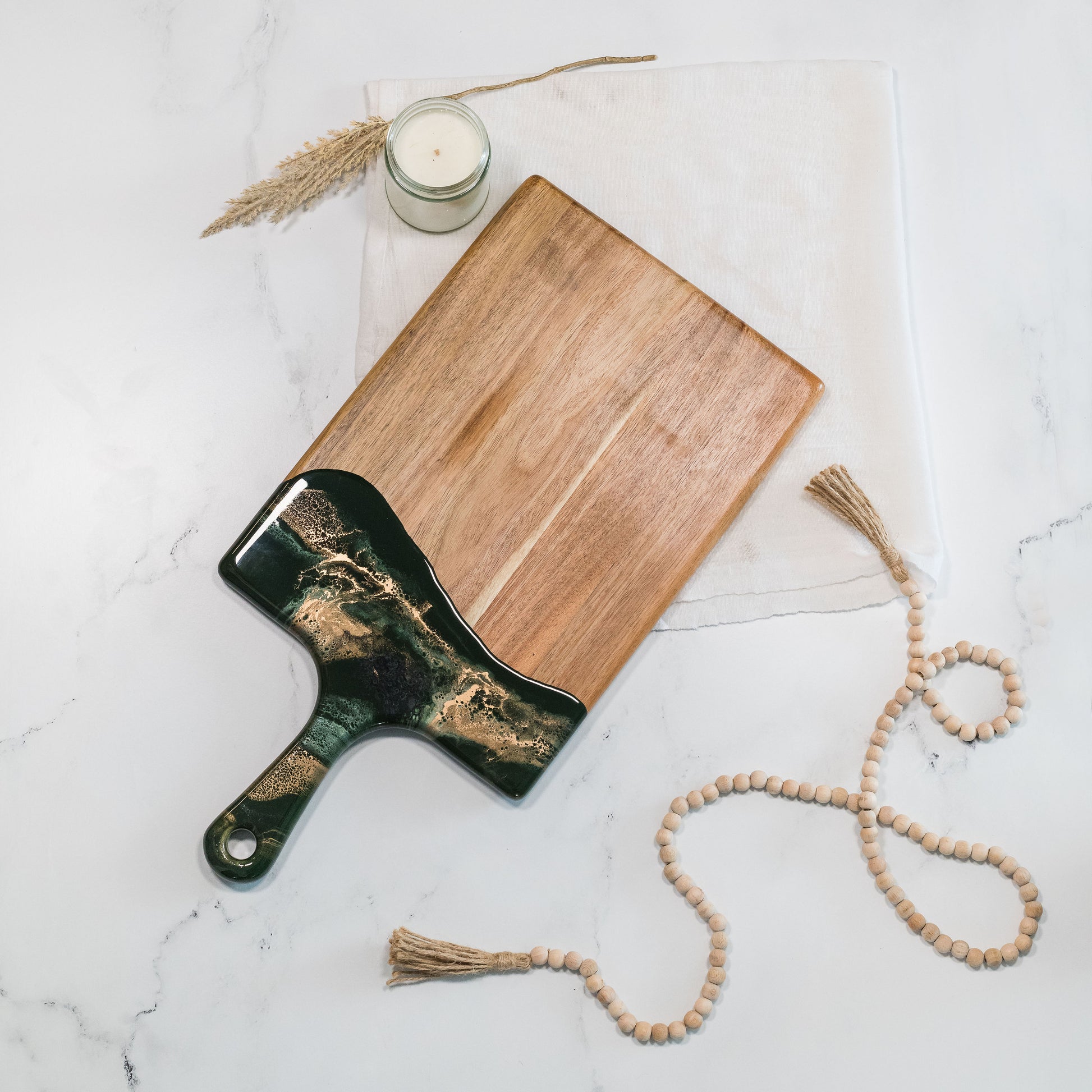 large acacia cheese board accented with resin