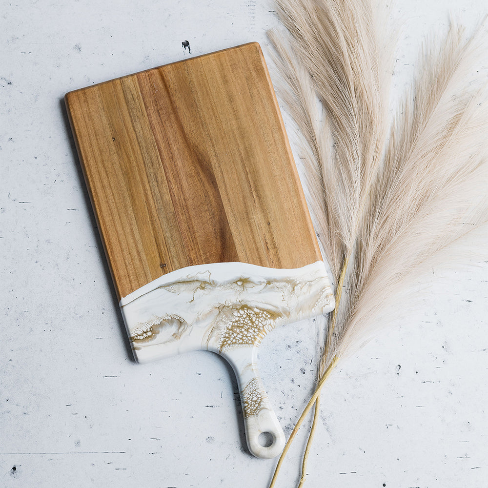 large acacia cheese board accented with resin