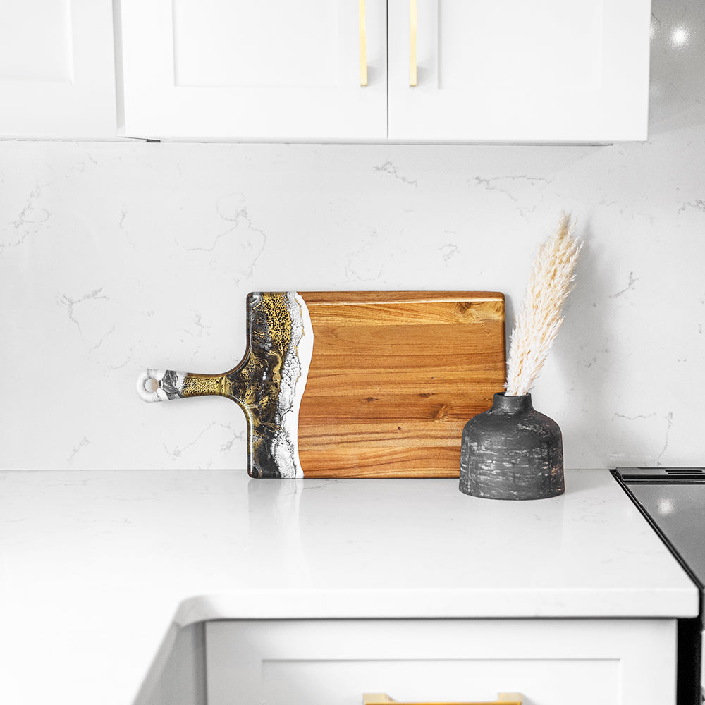 large acacia cheese board accented with resin