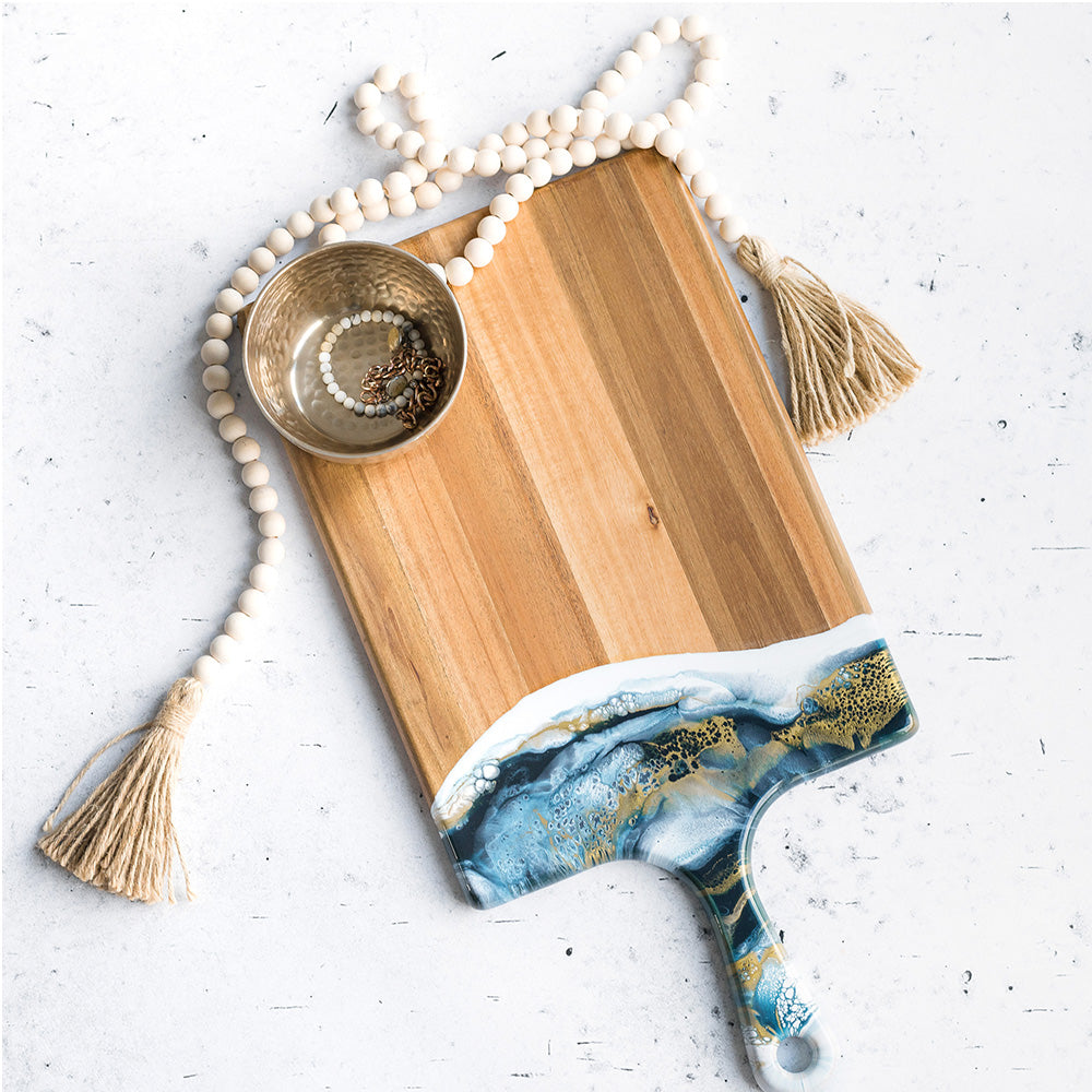 large acacia cheese board accented with resin