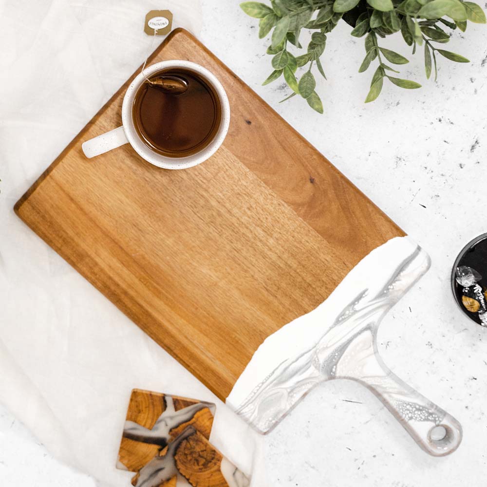 large acacia cheese board accented with resin