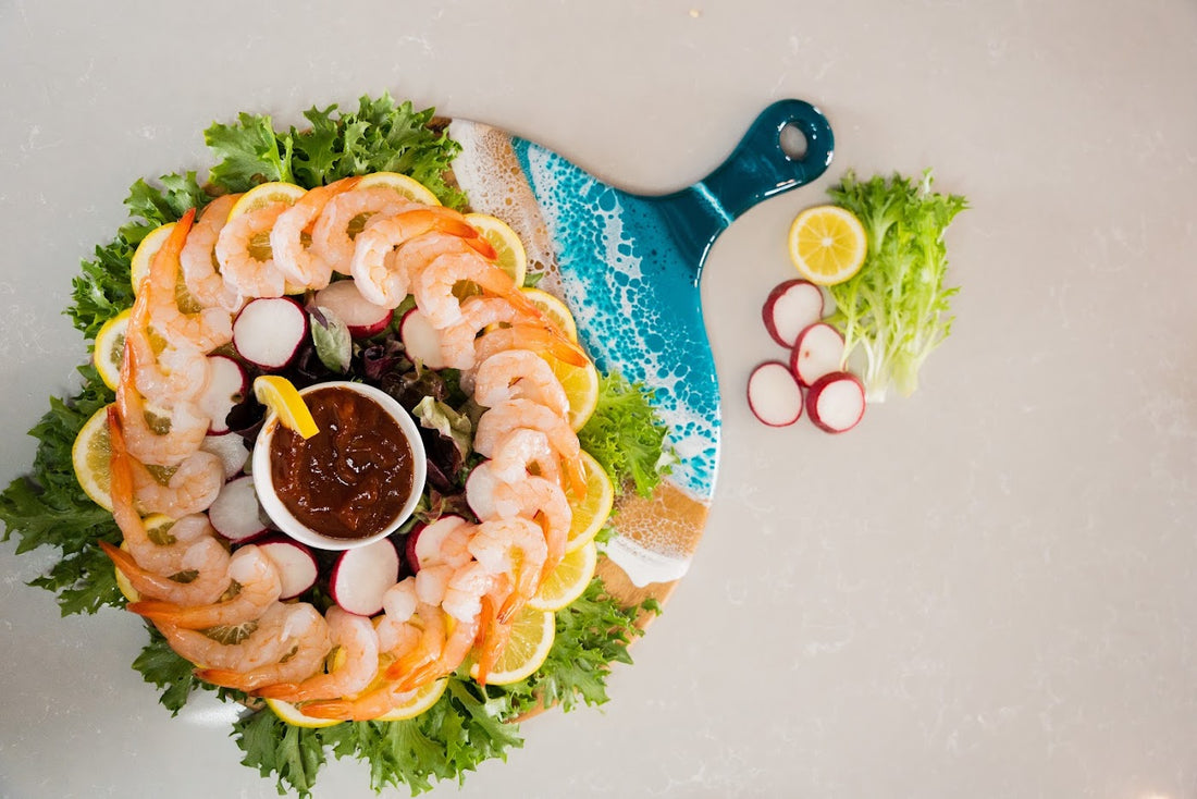 Shrimp Cocktail Plater on a paddle charcuterie board with ocean vibes epoxy handle