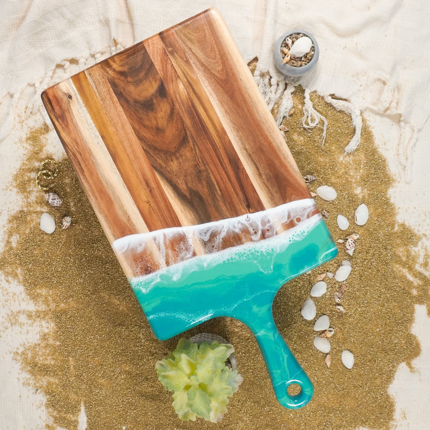 large acacia cheese board accented with resin