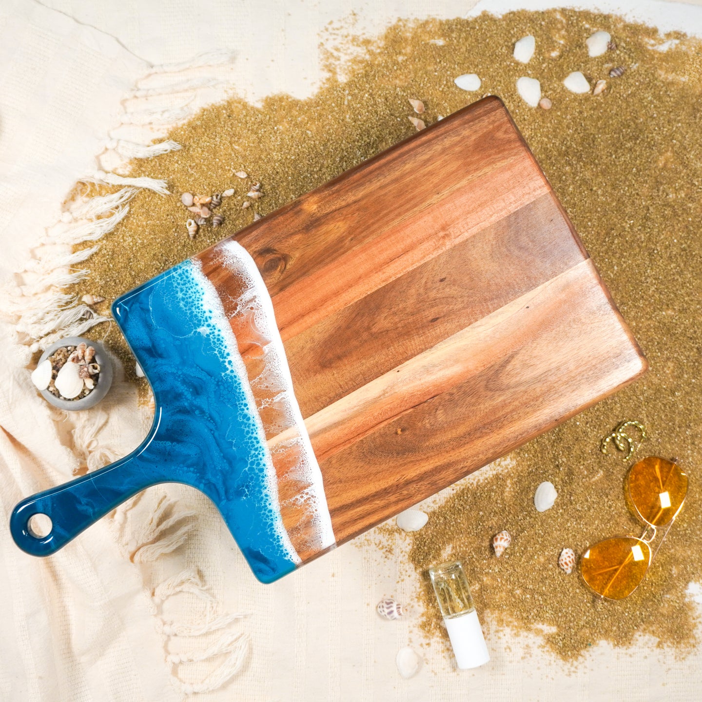 large acacia cheese board accented with resin