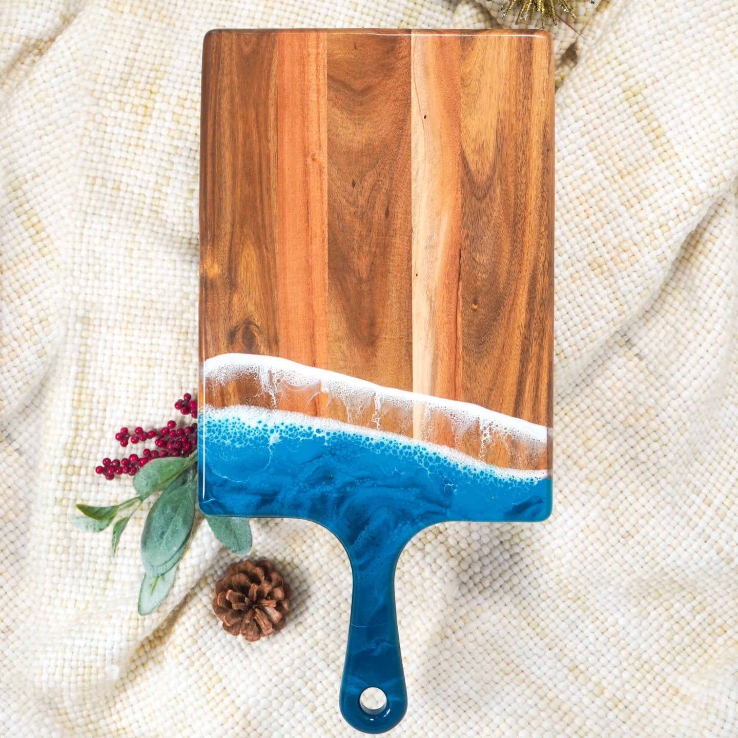 large acacia cheese board accented with resin