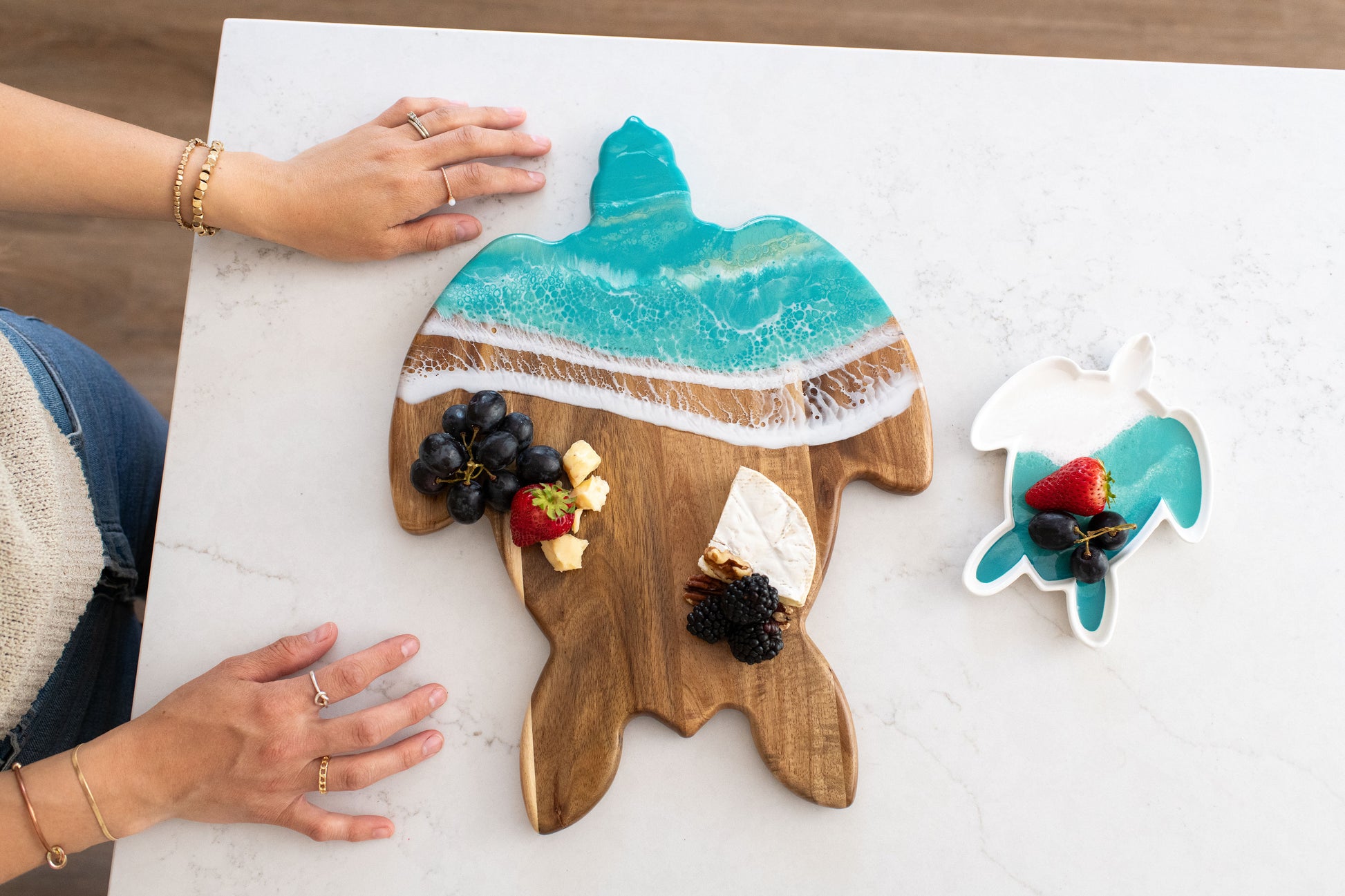 Wooden turtle-shaped Board with Caribbean blue resin design with a small matching turtle ceramic tray 