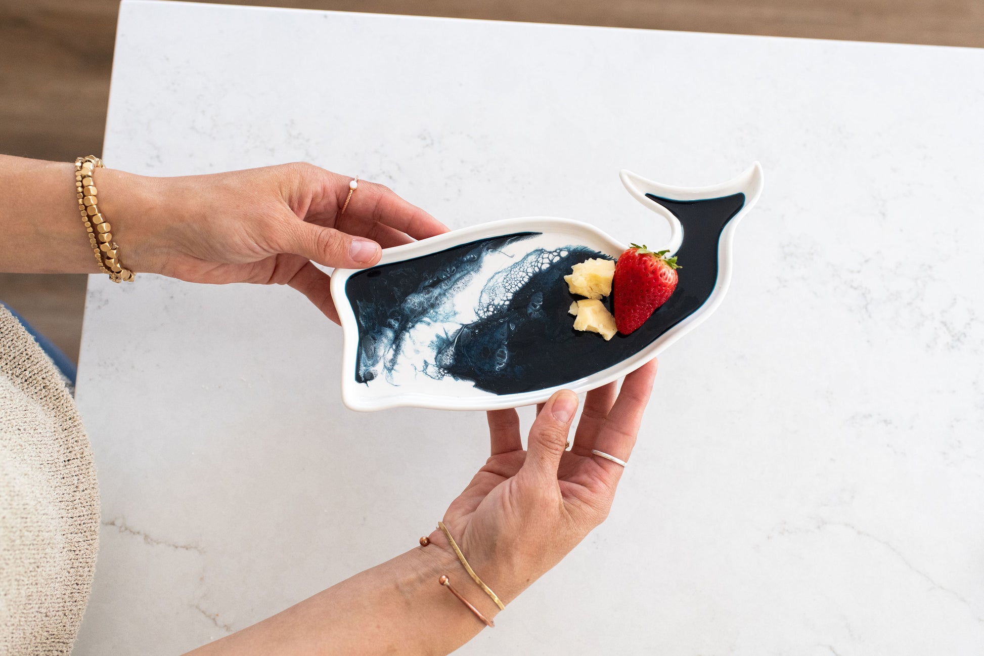 hands holding the navy white whale ceramic tray