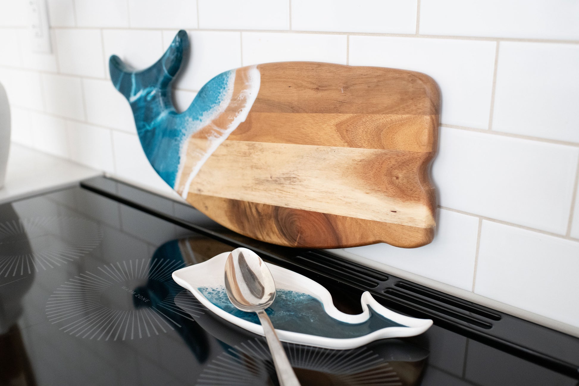 ocean vibes whale board with the matching whale ceramic tray in the kitchen