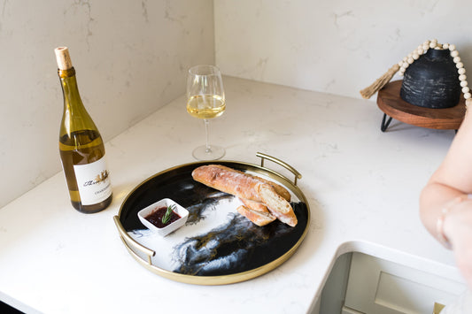 gold round metal tray accented with resin