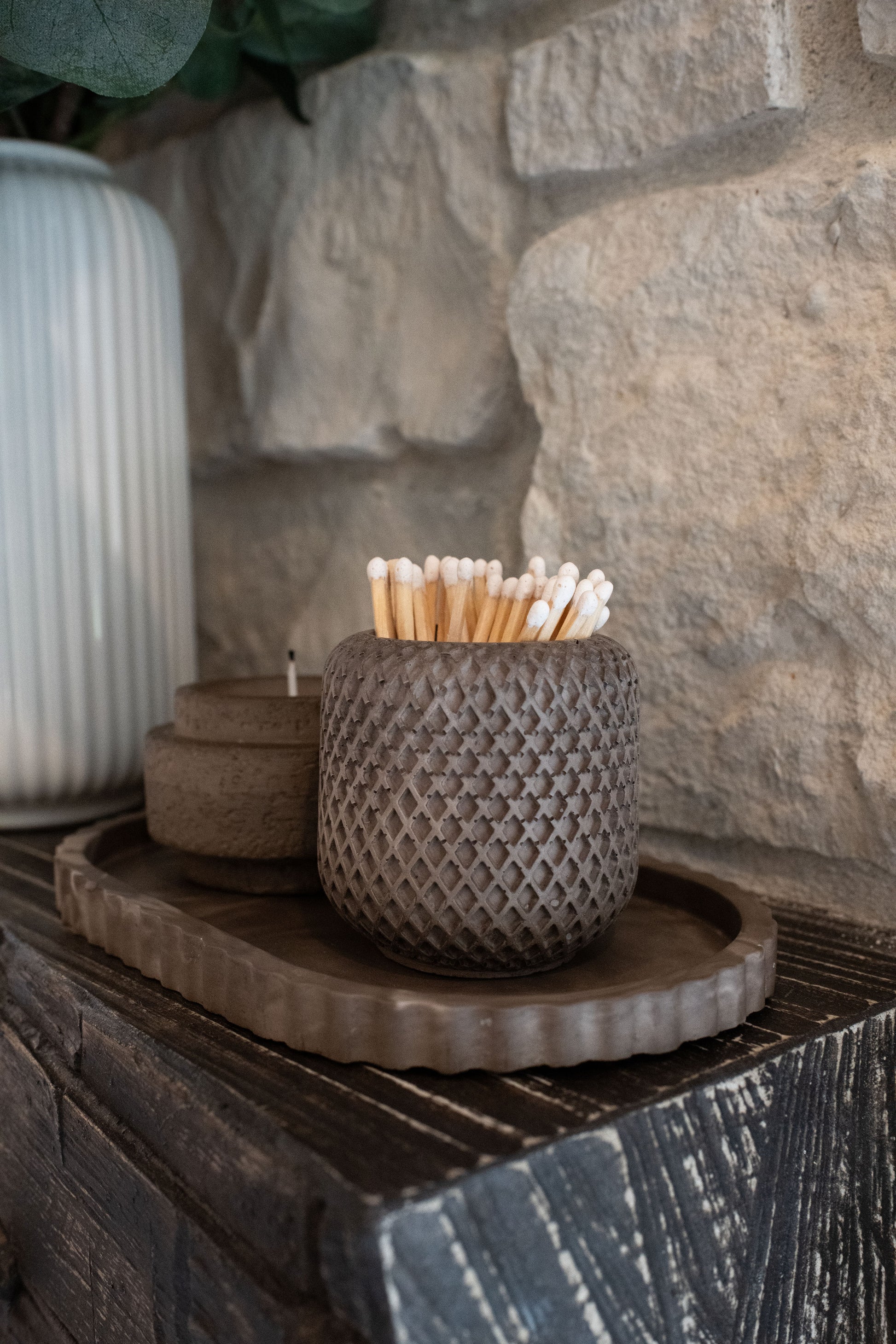 mocha oval tray with a candle holder and match holder displayed as a set 