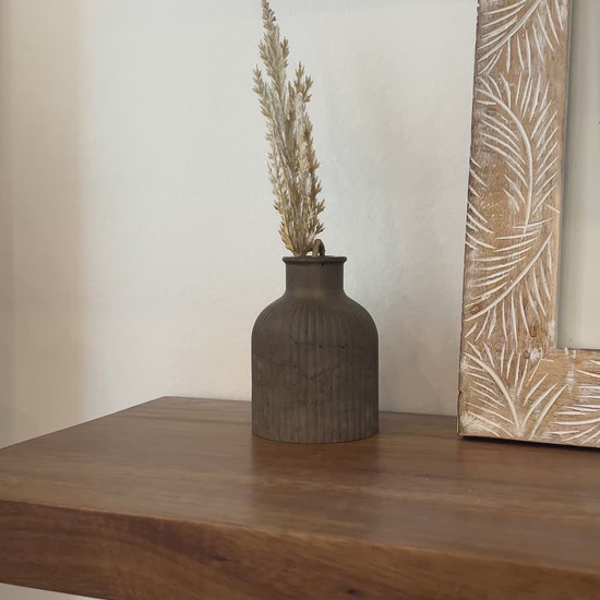 video showing the mocha budvase on a wooden shelf 