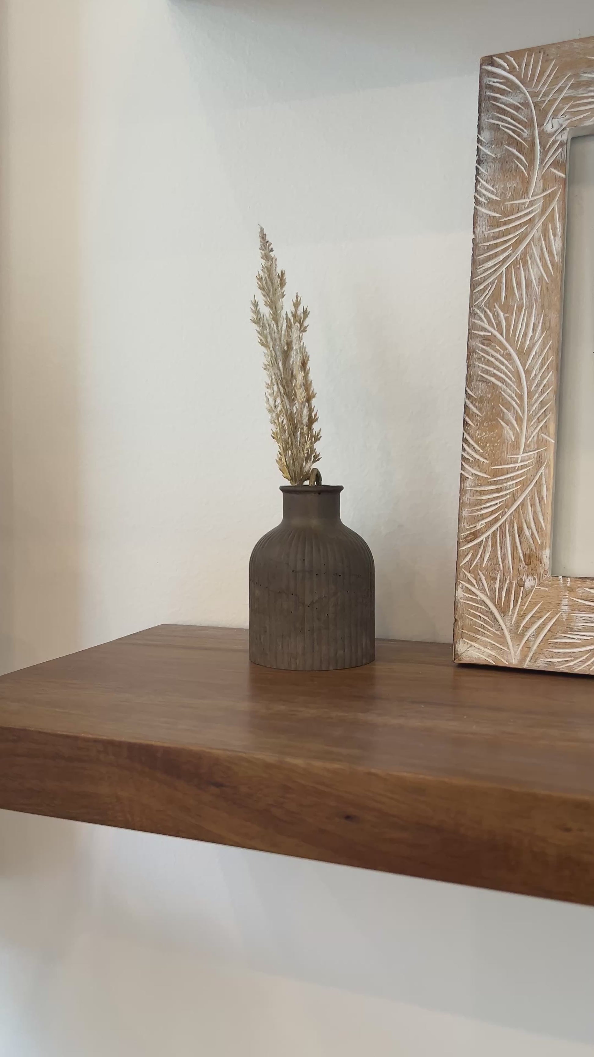video showing the mocha budvase on a wooden shelf 