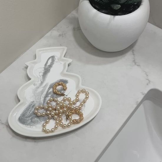 snowman shaped ceramic tray in a silver metallic resin design 