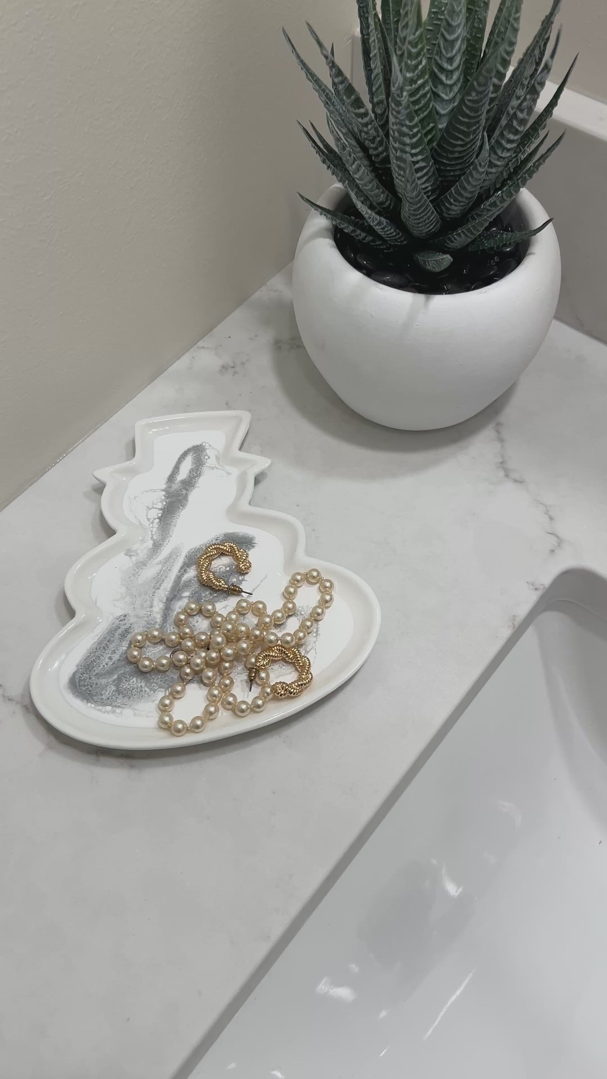 snowman shaped ceramic tray in a silver metallic resin design 