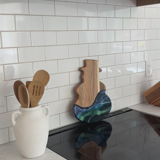video of the northern lights snowman against a white kitchen back splash 