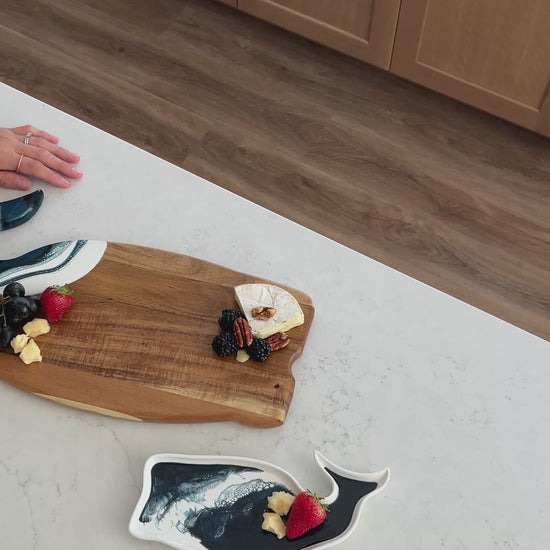 video of the navy whale board and matching ceramic tray on the kitchen counter 
