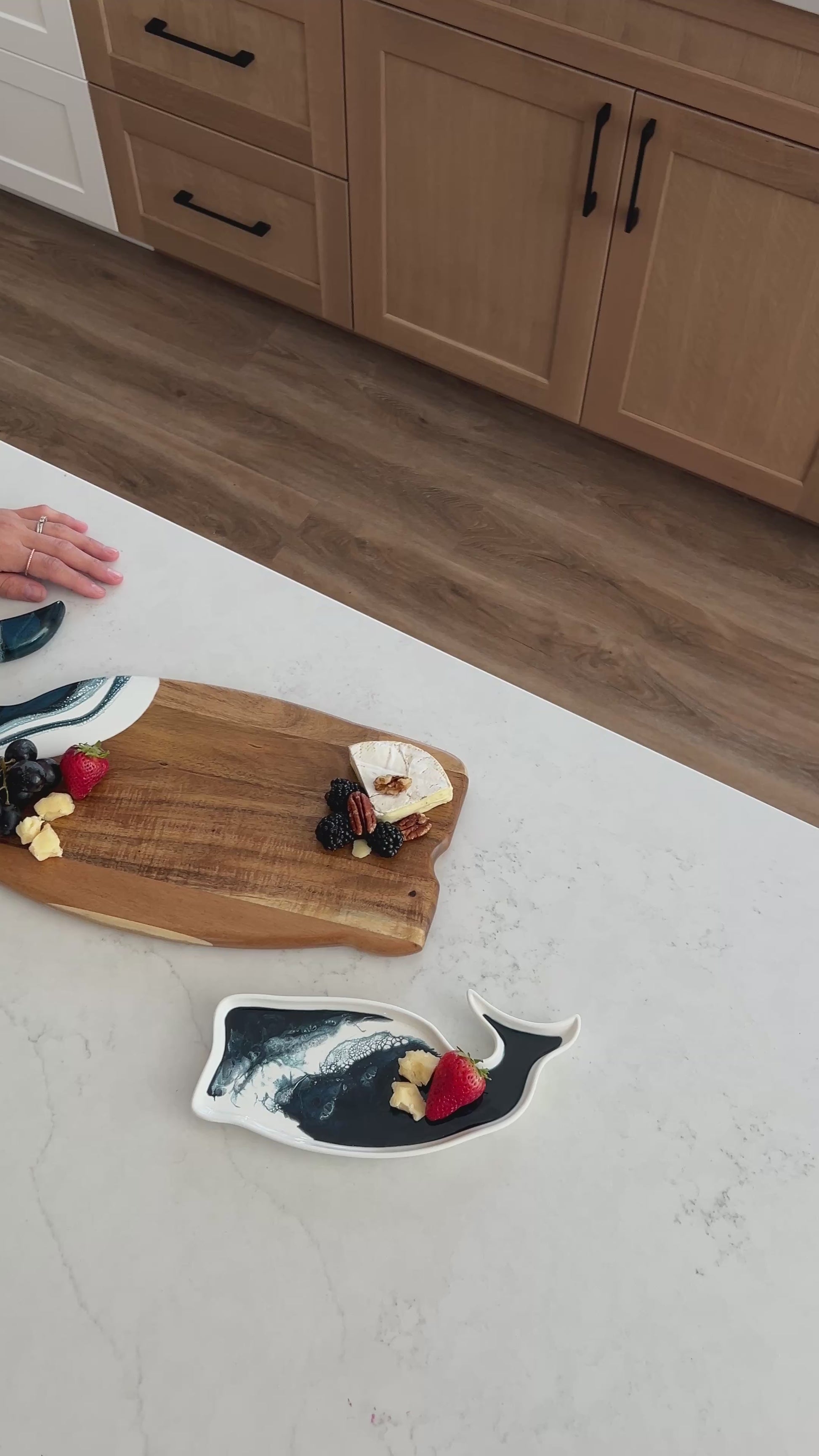video of the navy whale board and matching ceramic tray on the kitchen counter 
