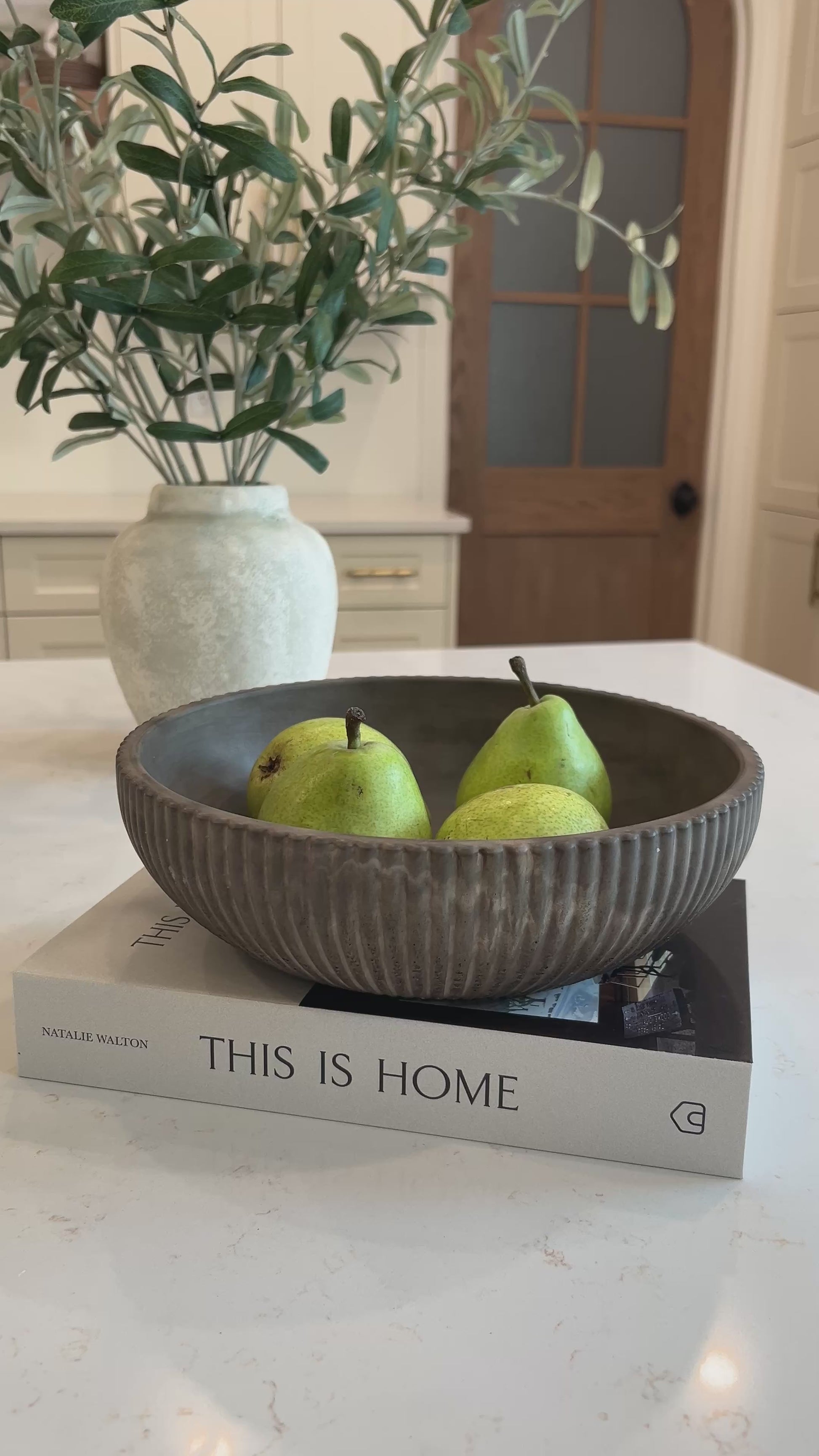 video of the mocha stone bowl on a decorative book in the kitchen 