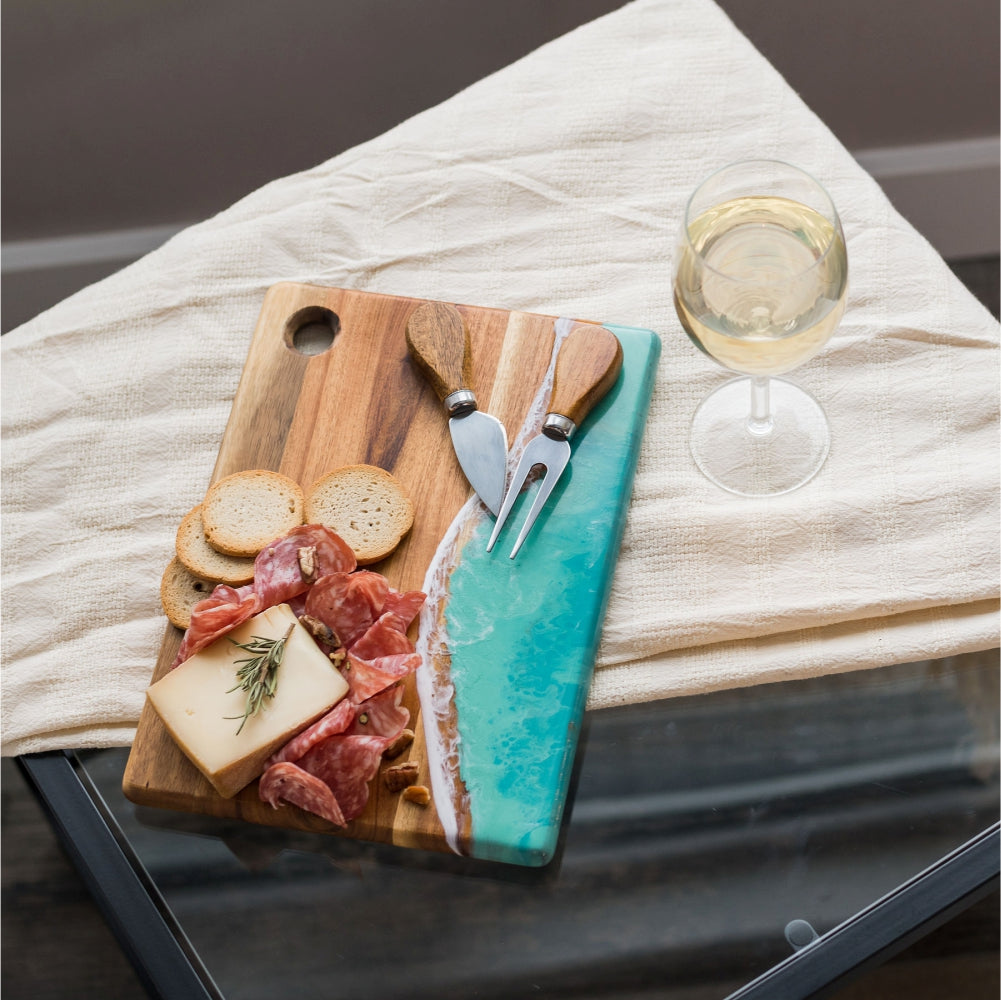 Small cheese boards, hand-made from high-quality Acacia hardwood, eco-friendly resin, a one-of-a-kind piece of serveware for your home. perfect for a single serving or to share with special someone! Caribbean Blue