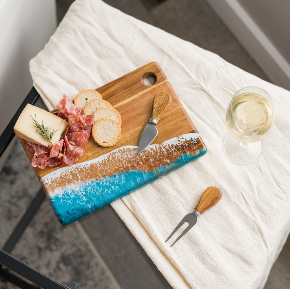 Small cheese boards, hand-made from high-quality Acacia hardwood, eco-friendly resin, a one-of-a-kind piece of serveware for your home. perfect for a single serving or to share with special someone! Ocean Vibes