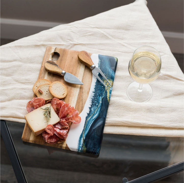 Small cheese boards, hand-made from high-quality Acacia hardwood, eco-friendly resin, a one-of-a-kind piece of serveware for your home. perfect for a single serving or to share with special someone! Sapphire Sky