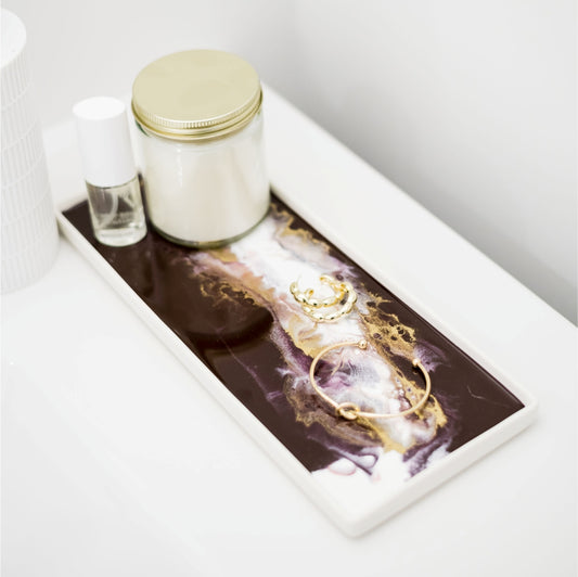 High-quality ceramic and resin trays. They make a perfect accent piece to any bathroom and can also be used as a gorgeous jewelry tray. Lynn & Liana Merlot