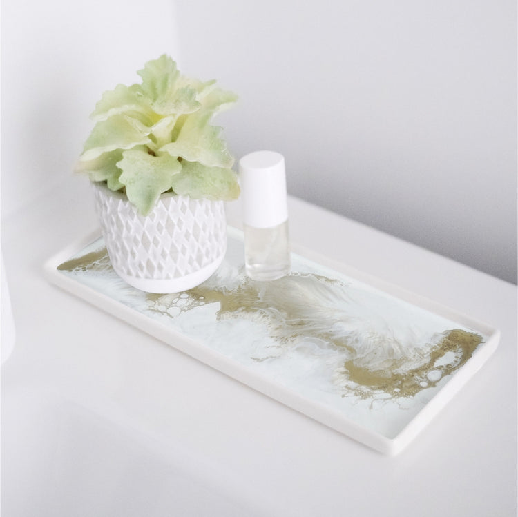 High-quality ceramic and resin trays. They make a perfect accent piece to any bathroom and can also be used as a gorgeous jewelry tray. Lynn & Liana Gold Quartz